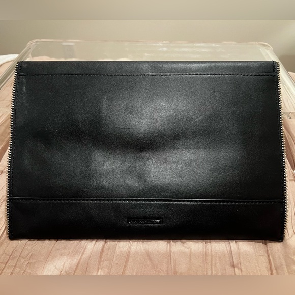 Black Rebecca Minkoff skinny clutch with star and zipper detailing. - Picture 2 of 4